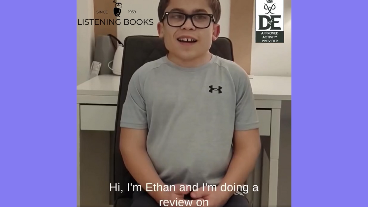 Rectangle with 2 purple sides, with photo of young member in grey t-shirt presenting their book review to camera.